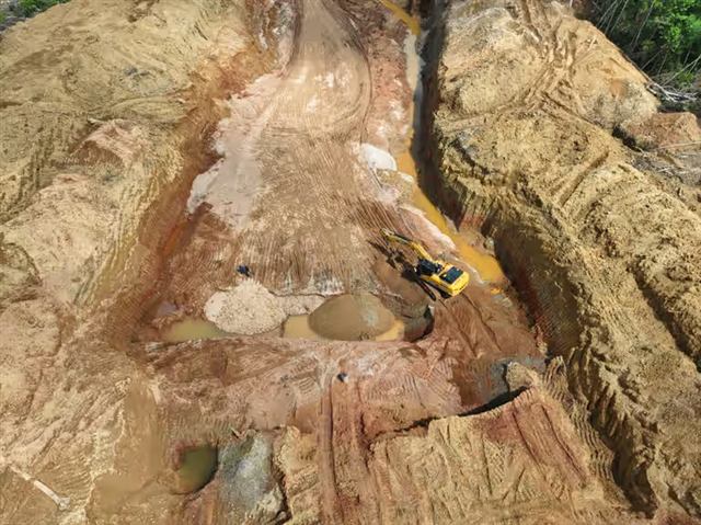 Open-pit mining area surrounded by rainforest
